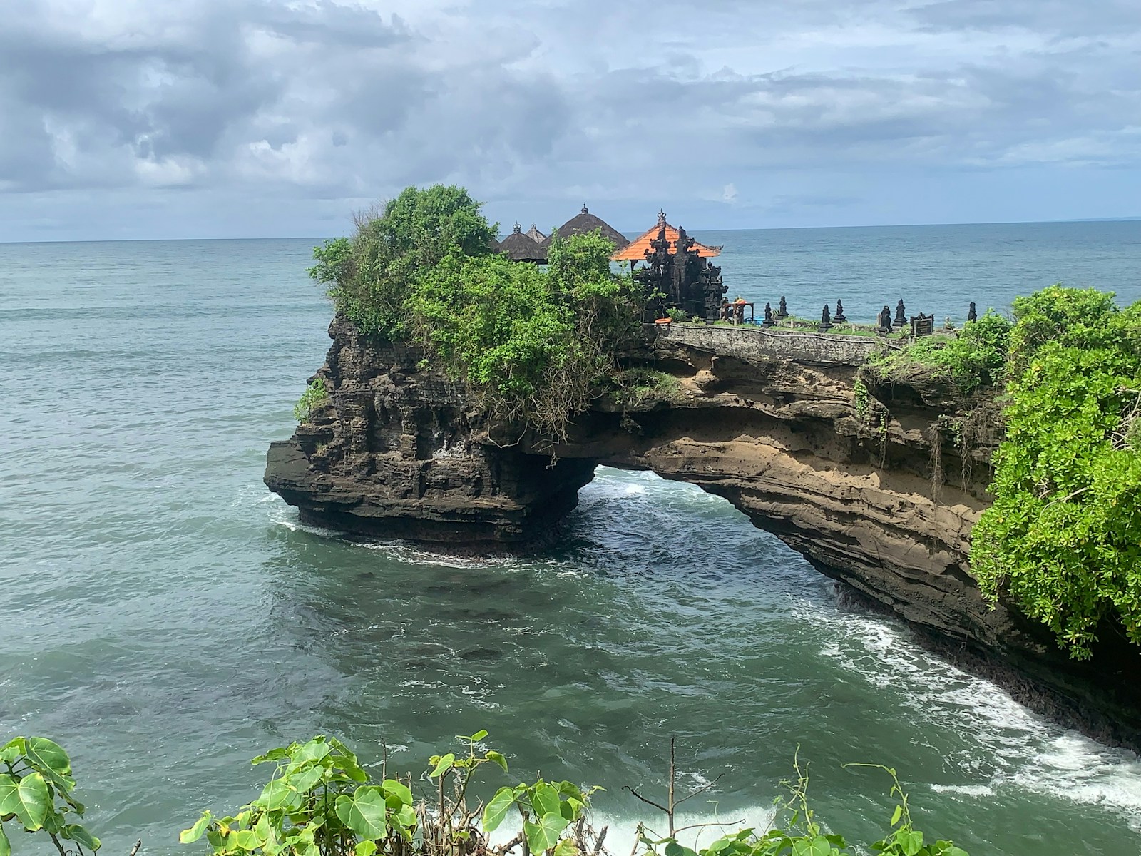 Tanah Lot sea temple perched on rocky island arch off the Bali coast