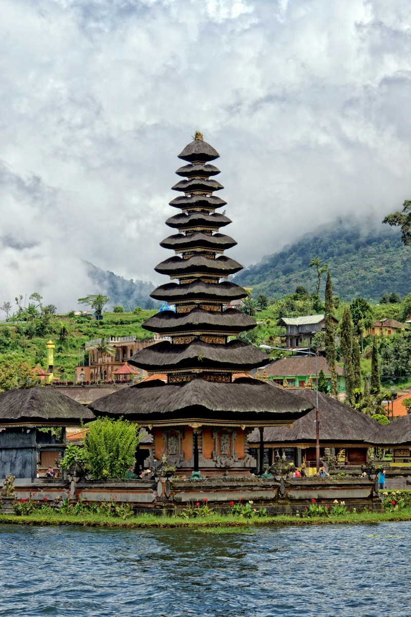 Ulun Danu Beratan water temple rising from a misty lake, Bali, Indonesia