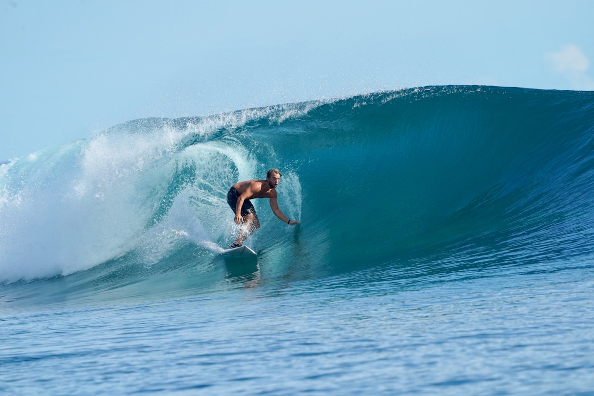Surfer riding a barrelling wave in the Mentawai Islands, West Sumatra, Indonesia