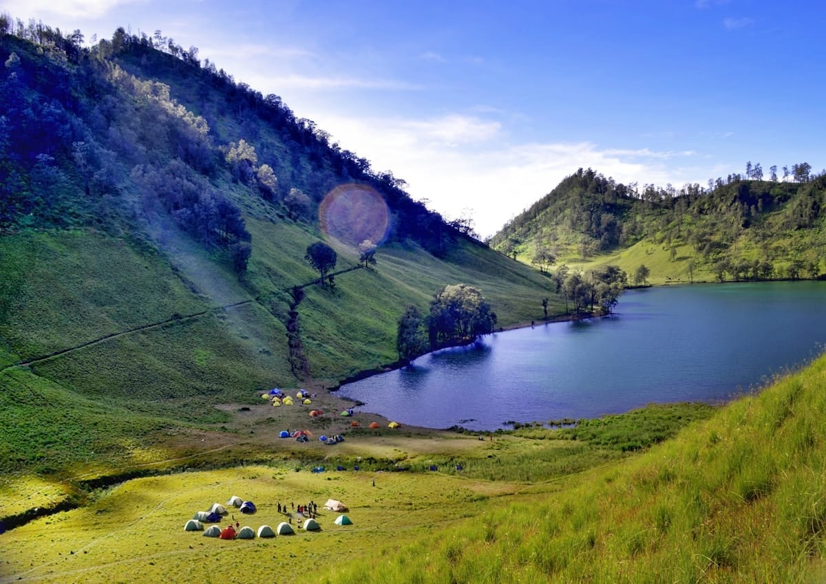 Trekkers camping at Ranu Kumbolo lake at the foot of Mount Semeru, East Java, Indonesia