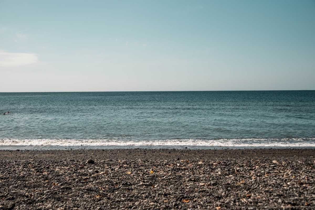 Sea waves crashing on shore during daytime, Amed, Bali, Indonesia