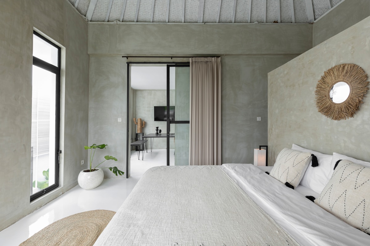Villa bedroom with glass sliding doors to garden, Berawa Beach, Canggu, Bali, Indonesia