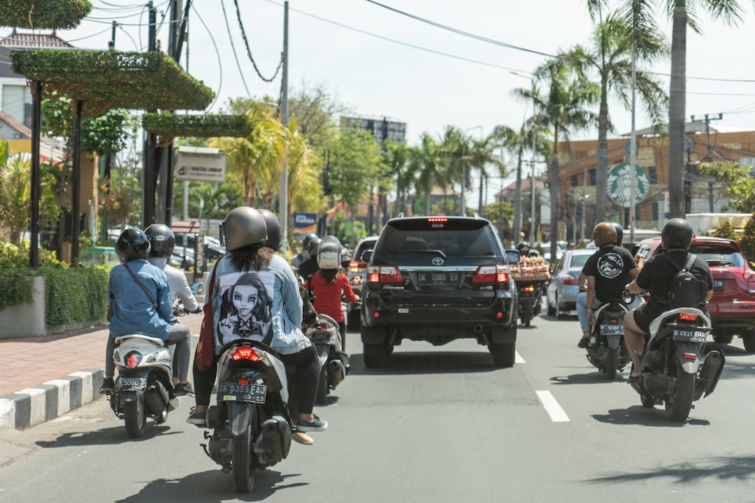 Scooters and motorbikes in Bali street traffic, Bali, Indonesia