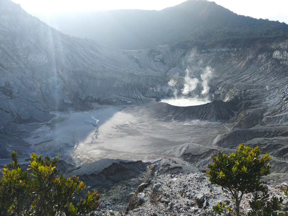 Tangkuban Perahu volcanic crater with steam vents and rocky terrain, West Java, Indonesia