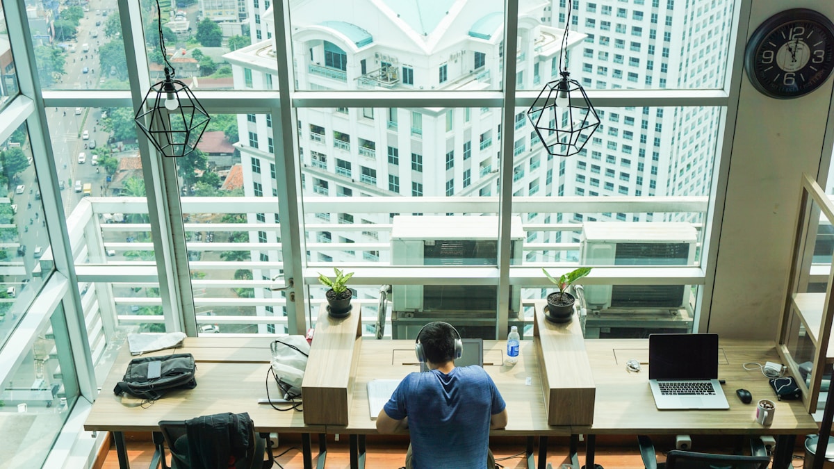 Man working on laptop at Rework Sudirman coworking space, Jakarta, Indonesia