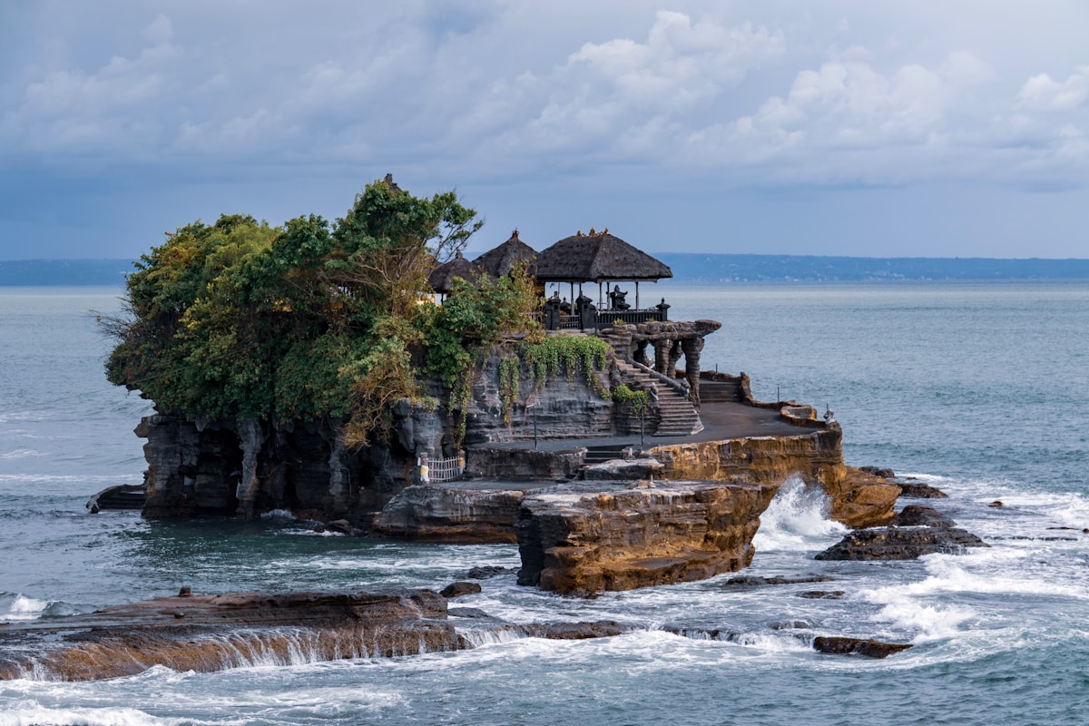 Tanah Lot temple on rock formation surrounded by sea, Bali, Indonesia