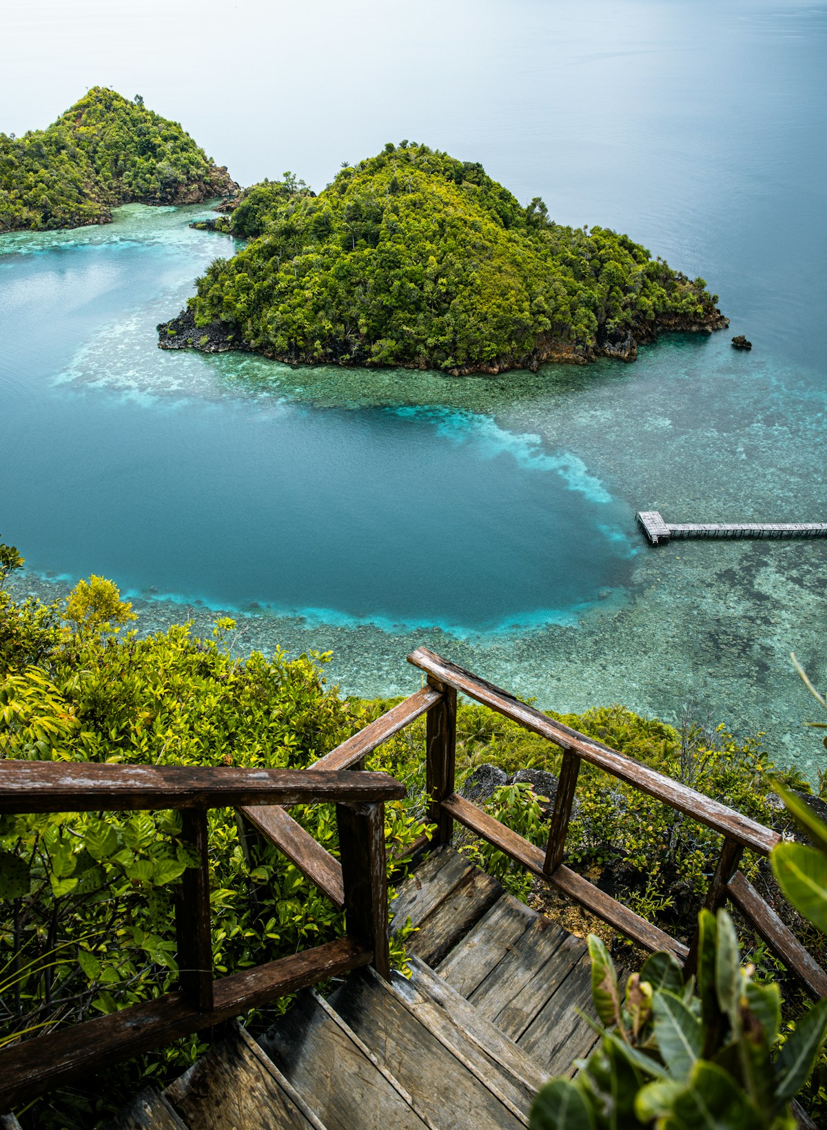 A wooden staircase leading to a remote island, Raja Ampat, West Papua, Indonesia
