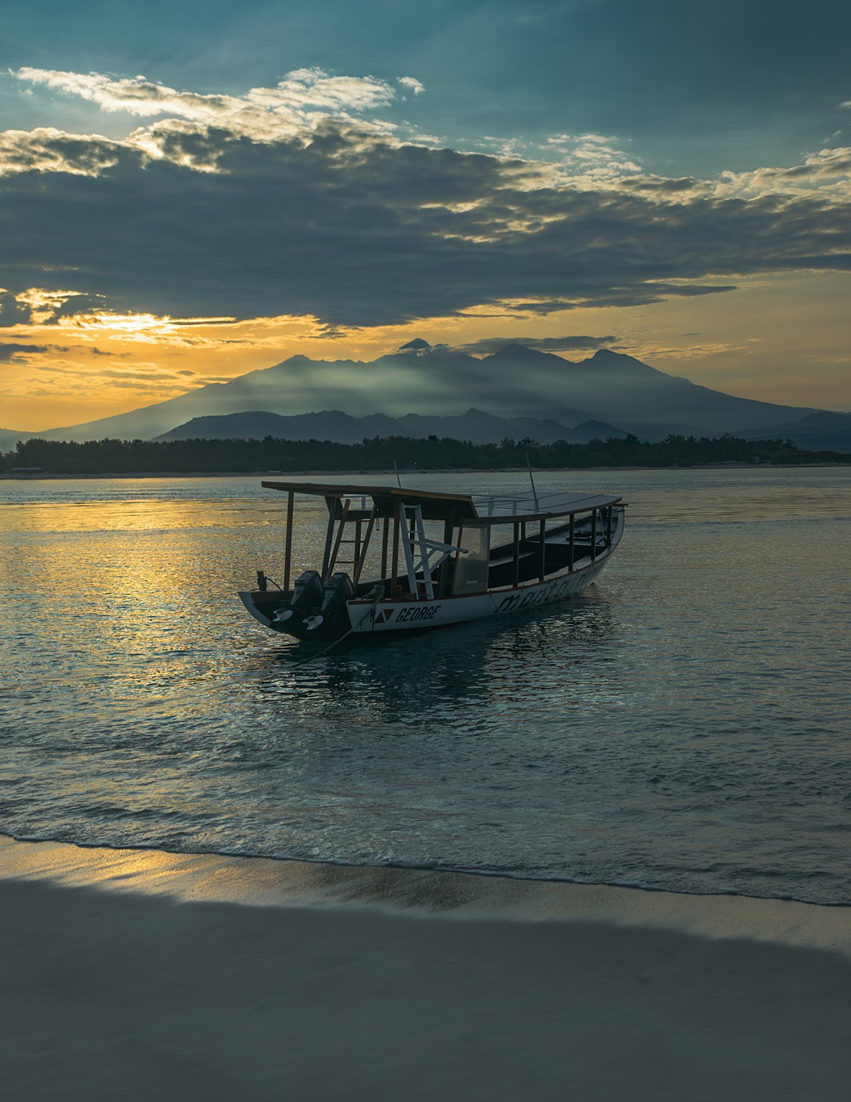 Traditional wooden boat on calm turquoise water, Gili Trawangan, Lombok, Indonesia