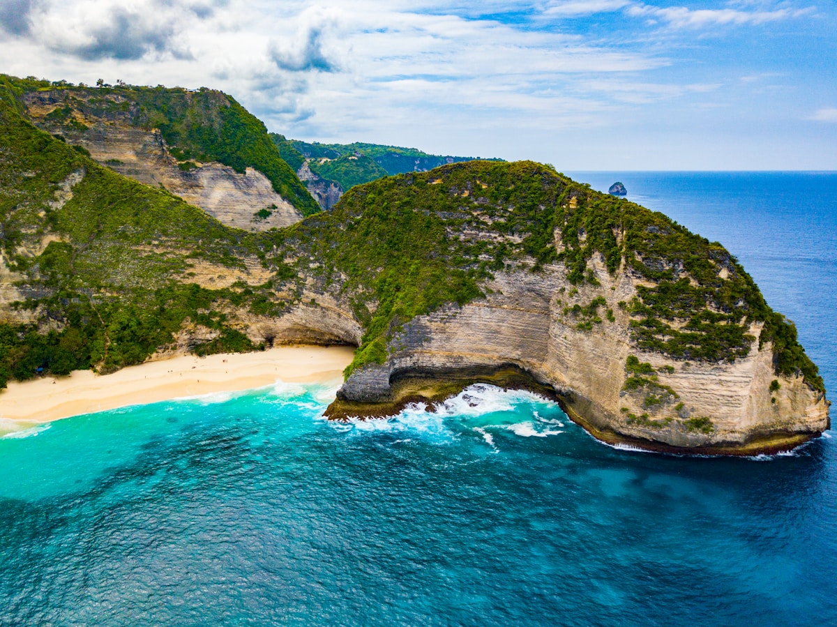 Aerial photography of Kelingking Beach island surrounded by water, Nusa Penida, Bali, Indonesia