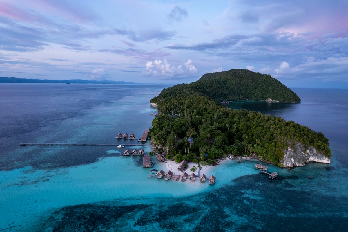 Aerial view of a tropical island surrounded by turquoise water
