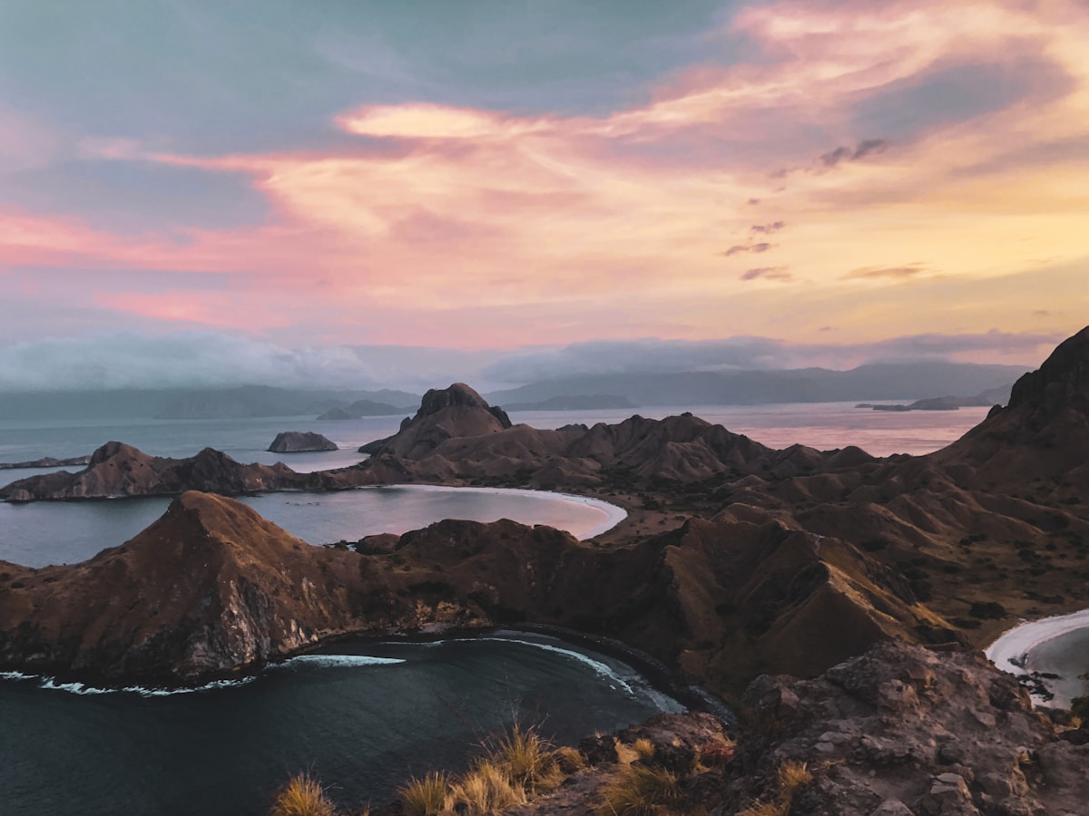 Bay at sunset with mountain silhouettes, Labuan Bajo, Flores, Indonesia