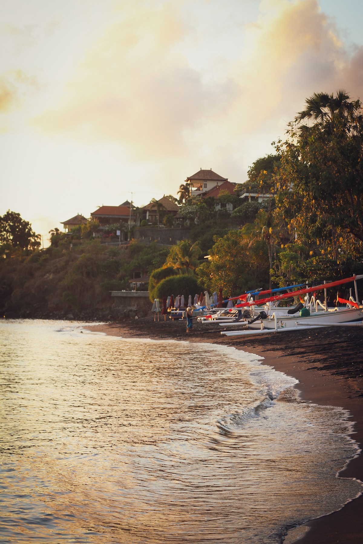 Fishing boats on the beach at low tide, Jimbaran Bay, Bali, Indonesia
