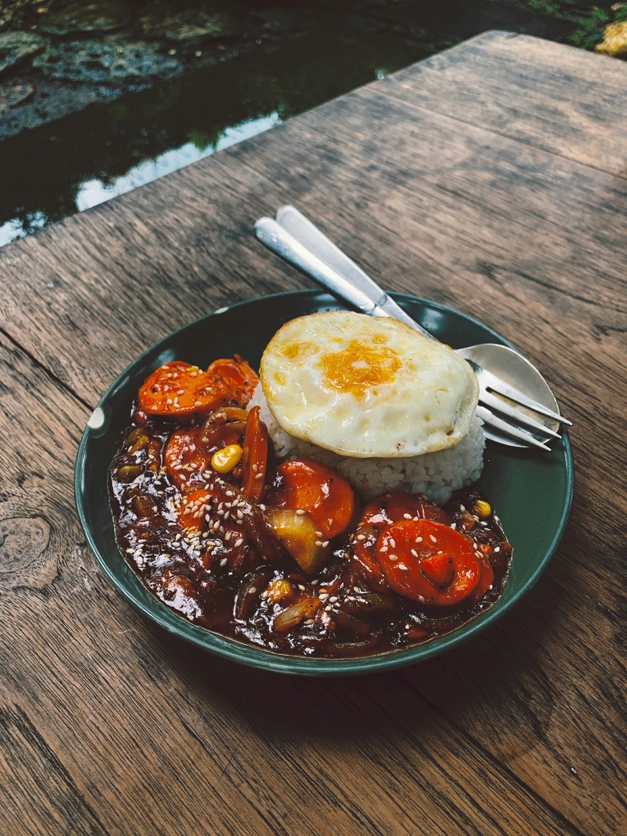 Plate of food on wooden table, Malang, Indonesia