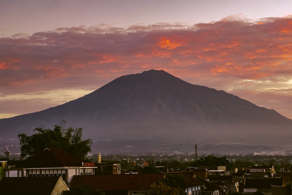 Sunset view of city with mountain in background, Malang, East Java, Indonesia