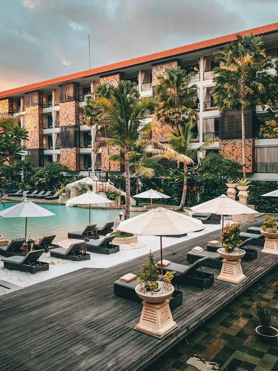 White patio umbrella near swimming pool, Indonesia