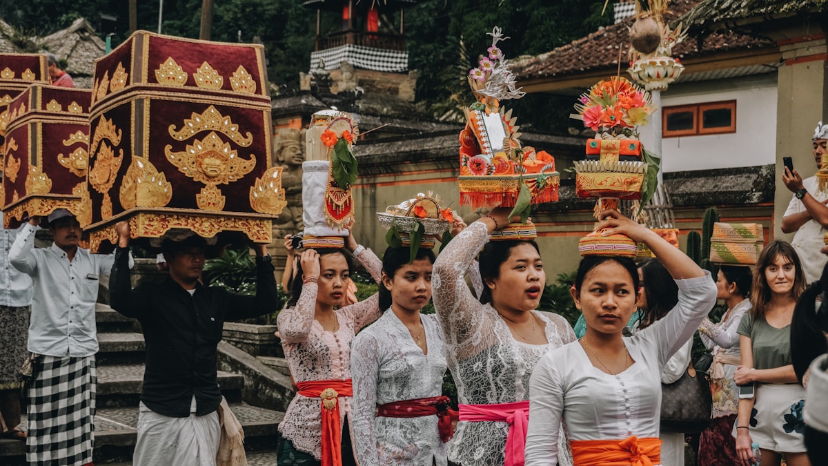 People at ceremony carrying pots, Bali, Indonesia