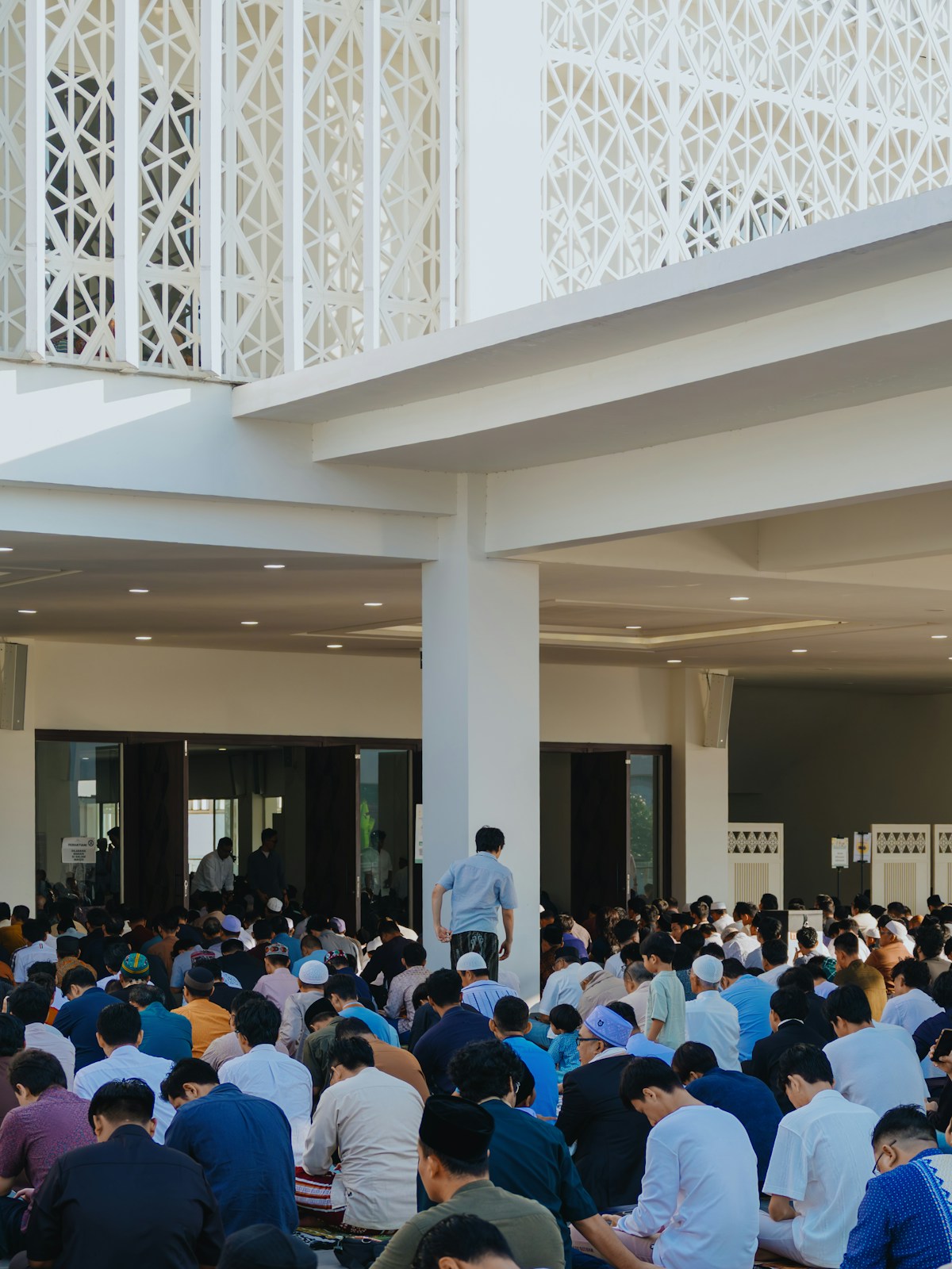 People praying inside a modern mosque, Indonesia