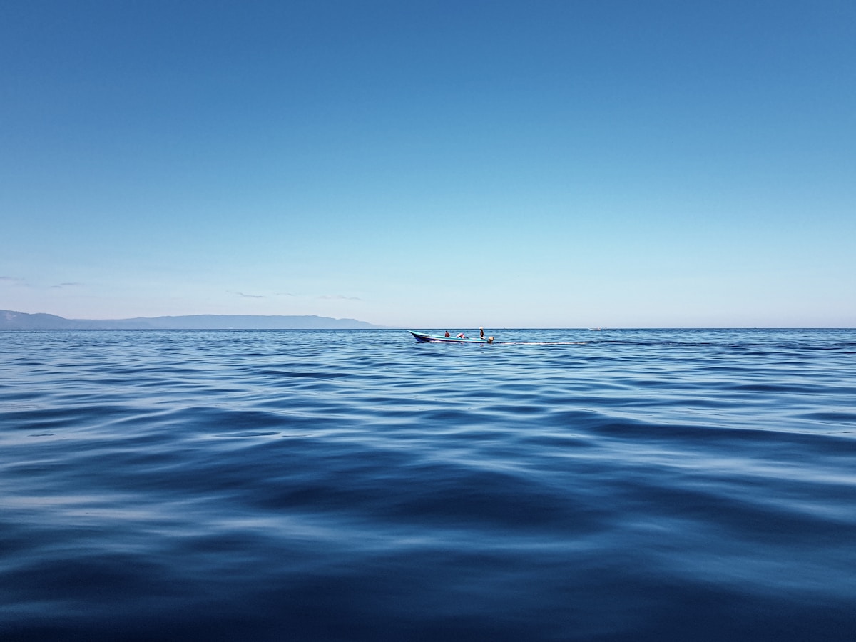 Person in boat on sea during daytime, North Sulawesi, Indonesia