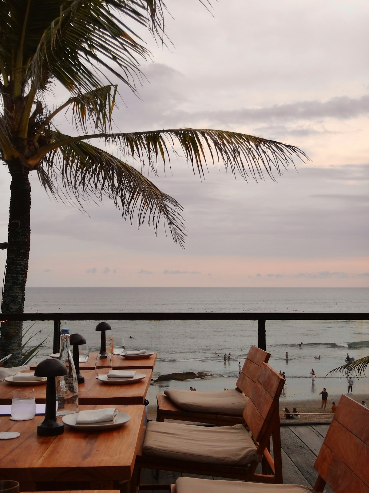 Outdoor restaurant terrace with ocean view at sunset, Nusa Dua, Bali, Indonesia