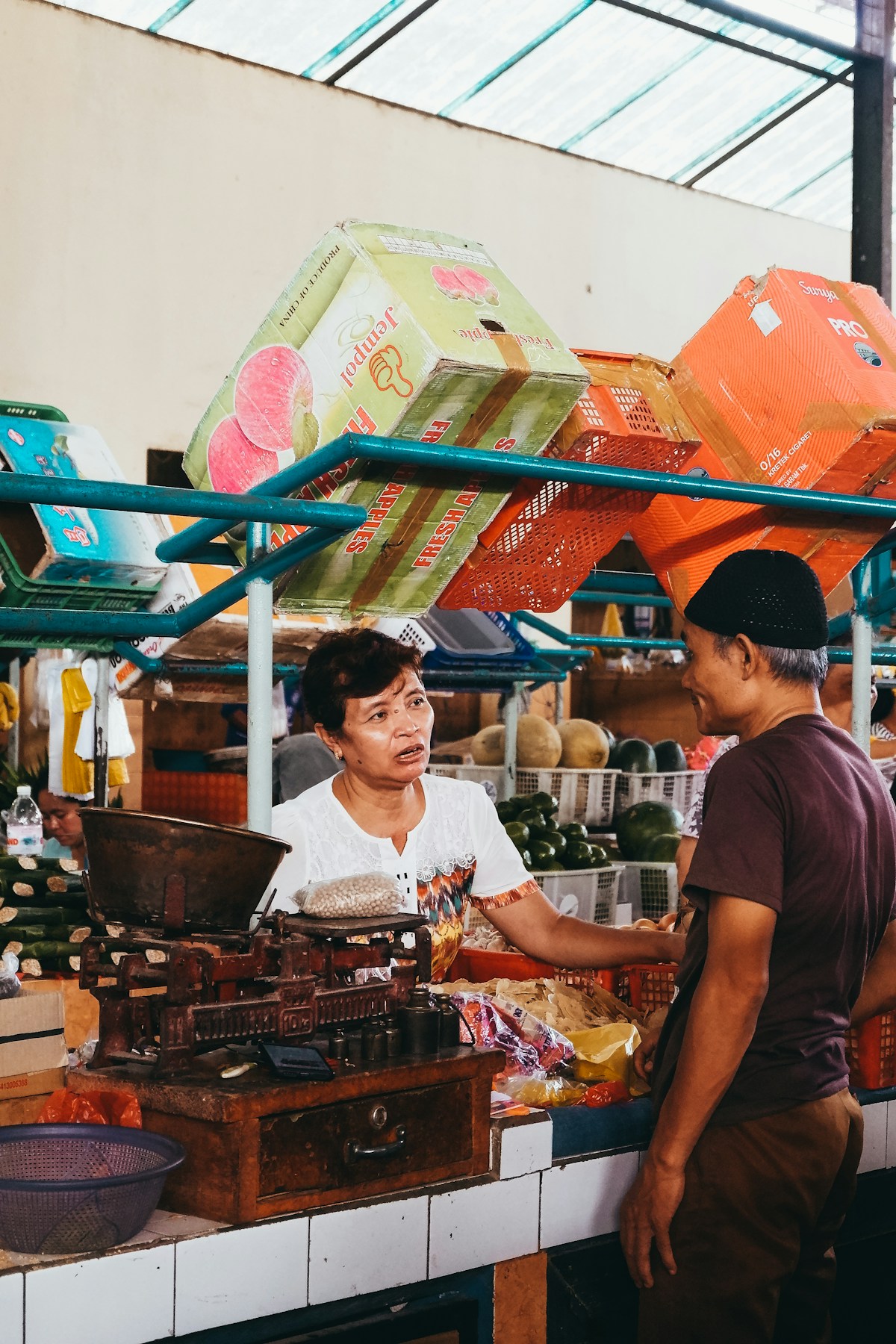 Man and woman in a traditional market store, Lampung, Indonesia