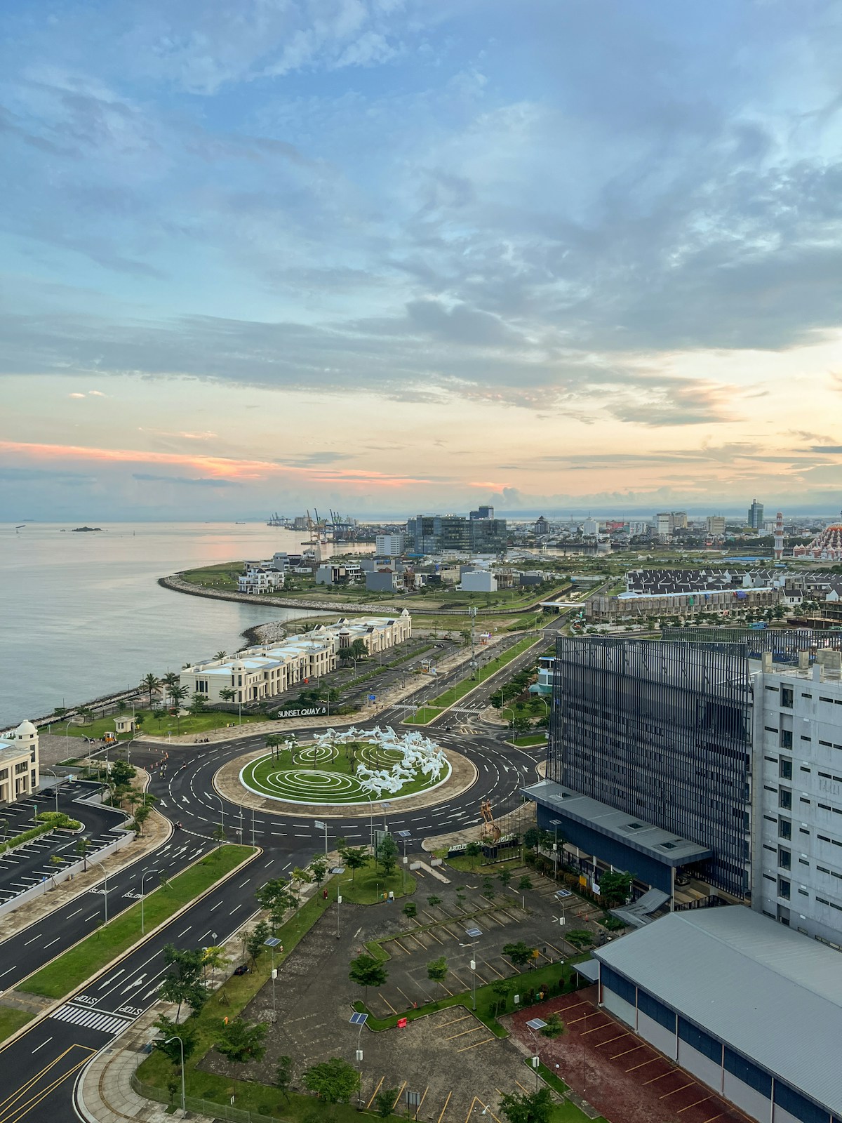 Aerial view of Makassar waterfront with roundabout and port, South Sulawesi, Indonesia