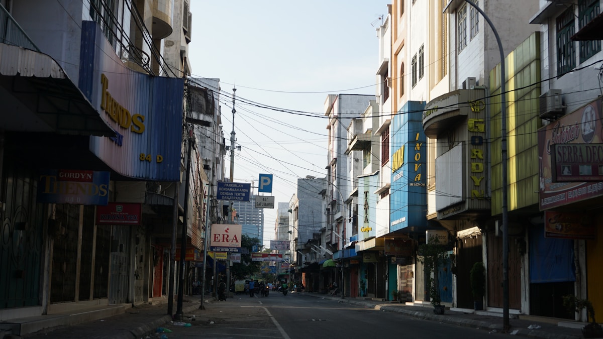 City street with shophouses and signs in central Medan, North Sumatra, Indonesia