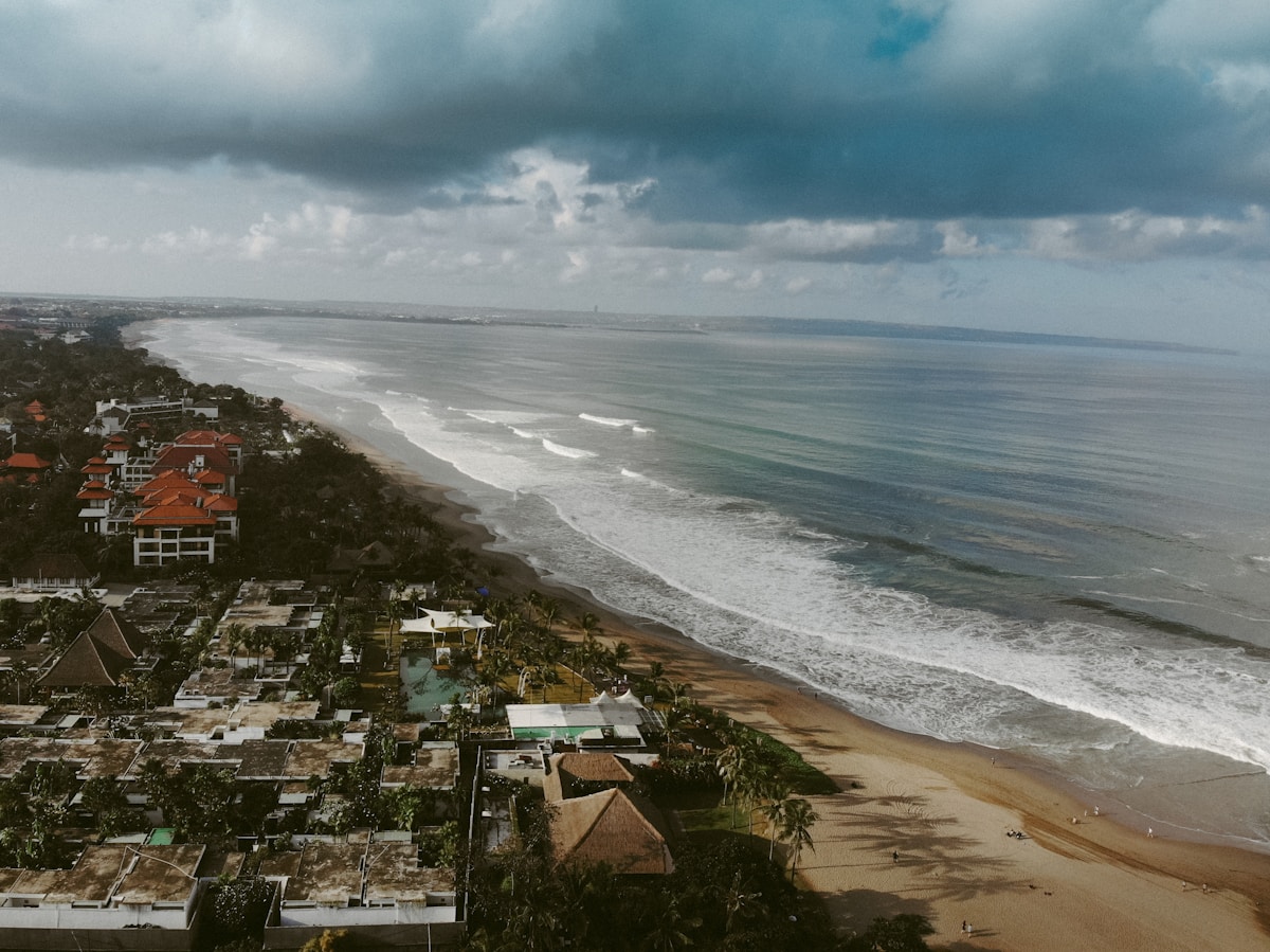 Aerial view of Seminyak coastline and city near the sea, Bali, Indonesia