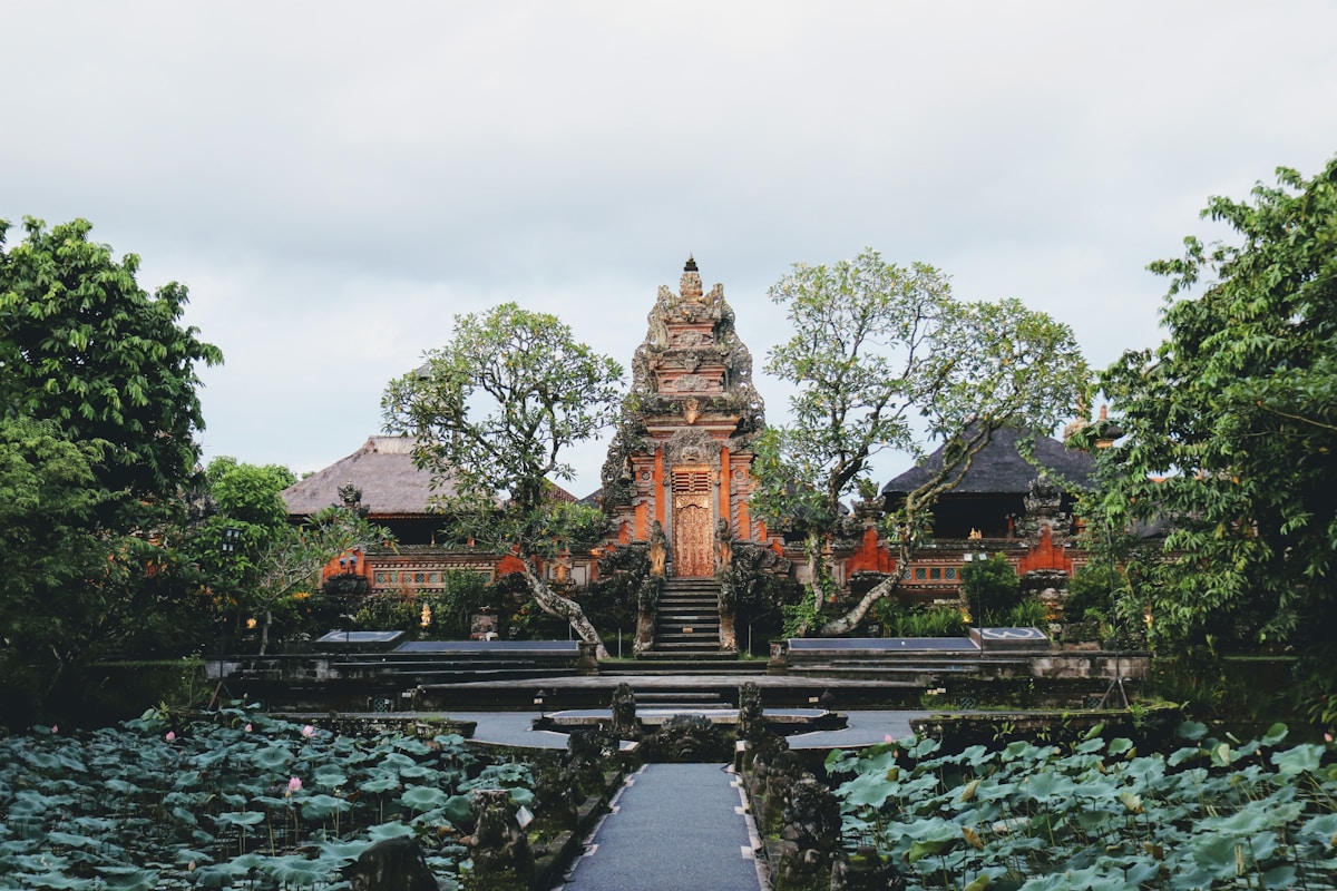 Large open-air building surrounded by lush trees and plants, Ubud, Bali, Indonesia