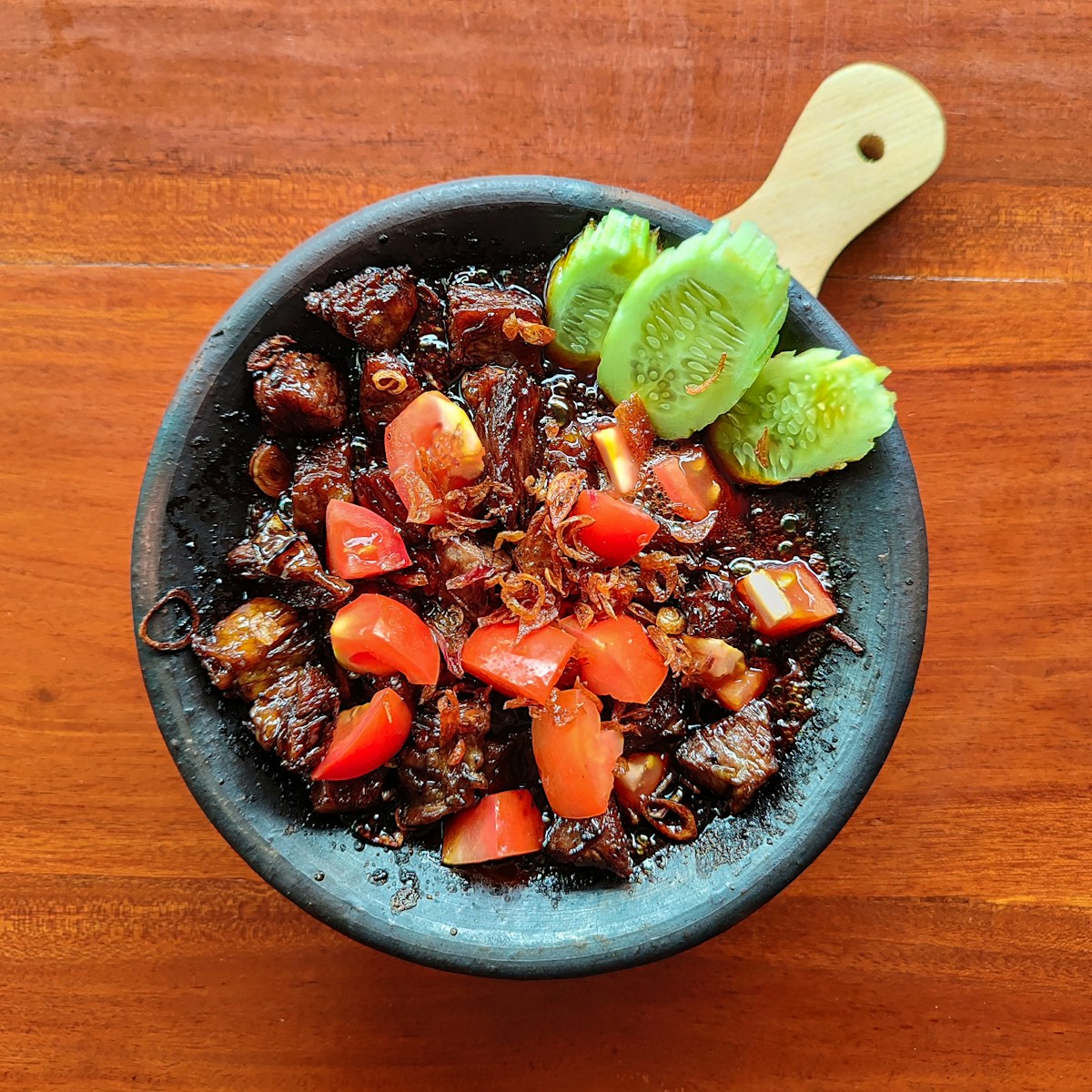 Indonesian caramelised beef dish served on a hot plate, Jakarta, Indonesia
