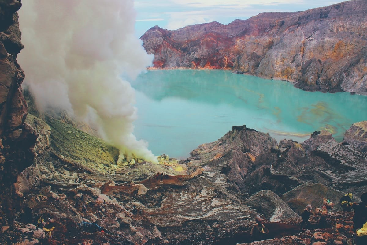 Kawah Ijen crater lake with sulfur smoke, Banyuwangi Regency, East Java, Indonesia