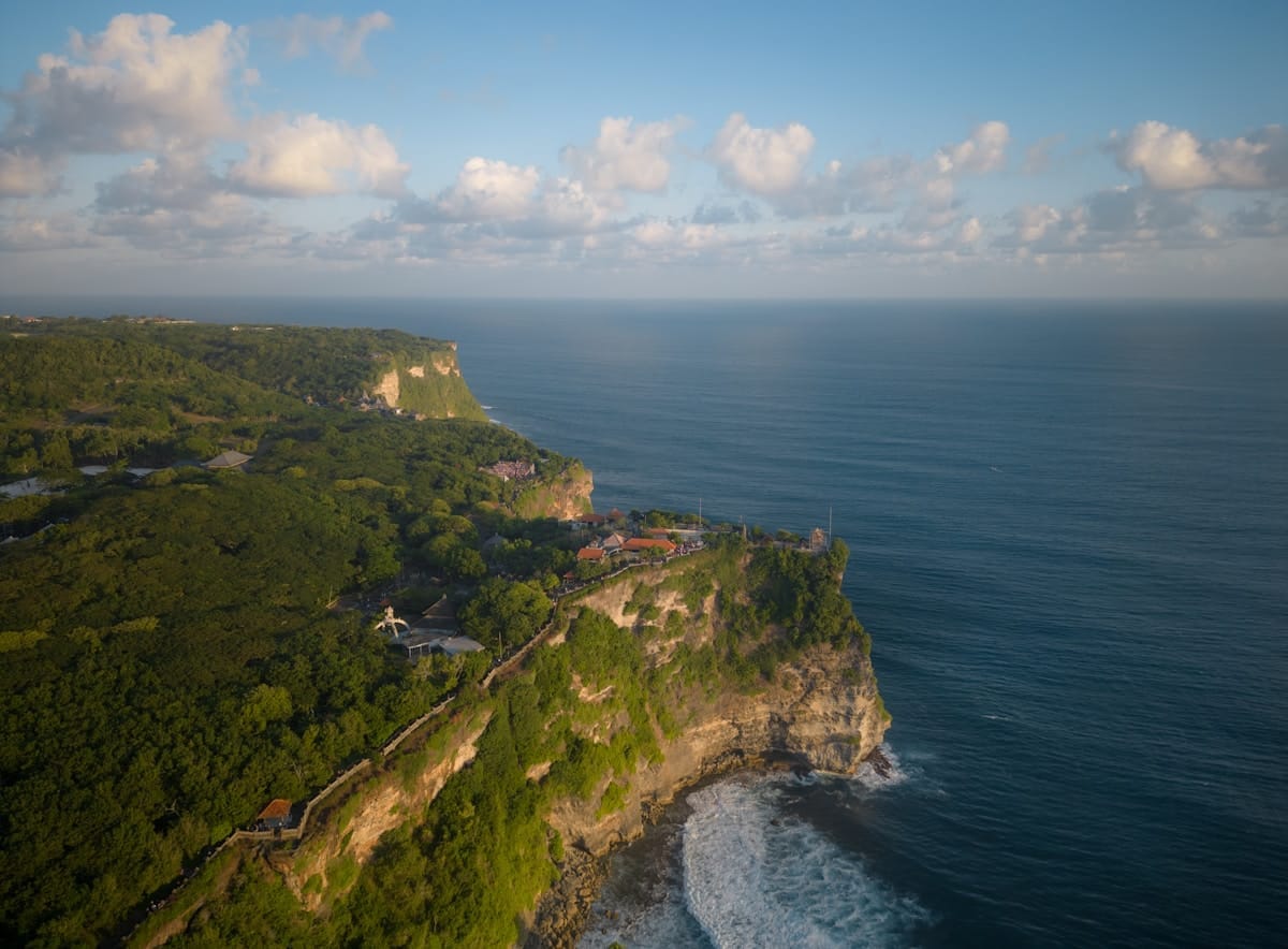 Aerial view of tropical cliffs and coastline overlooking the Indian Ocean, Bali, Indonesia