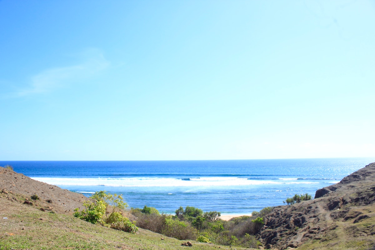 View of turquoise ocean and surf breaks from Merese Hills, Kuta, Central Lombok, Indonesia