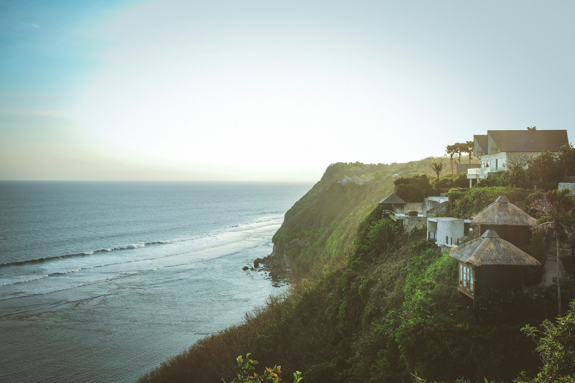 Clifftop villas and bungalows perched above the Indian Ocean, Uluwatu, Bali